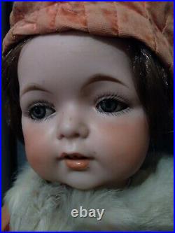 16 Charming Antique sweet faced character bebe. Bisque doll