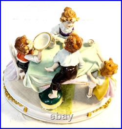#7 Figurine Antique German Large Oval Base 6 Tall 4 Children at the Table