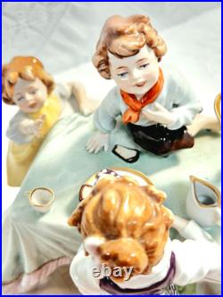 #7 Figurine Antique German Large Oval Base 6 Tall 4 Children at the Table