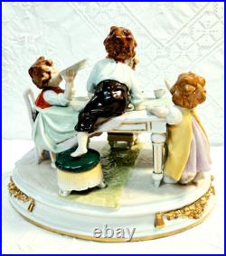 #7 Figurine Antique German Large Oval Base 6 Tall 4 Children at the Table