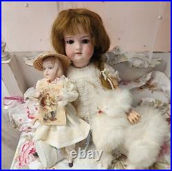 A. M 390 bisque head doll, German circa 1910/ With Doll / Antique Fur Dog/ Book A. M 390 bisque head doll, German circa 1910/ With Doll / Antique Fur Dog/ Book