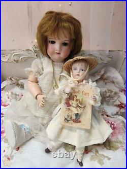 A. M 390 bisque head doll, German circa 1910/ With Doll / Antique Fur Dog/ Book A. M 390 bisque head doll, German circa 1910/ With Doll / Antique Fur Dog/ Book
