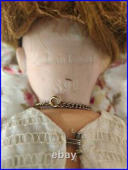 A. M 390 bisque head doll, German circa 1910/ With Doll / Antique Fur Dog/ Book A. M 390 bisque head doll, German circa 1910/ With Doll / Antique Fur Dog/ Book