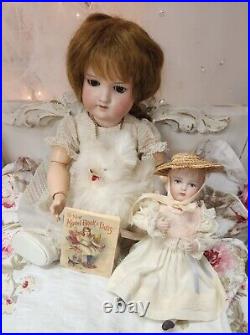 A. M 390 bisque head doll, German circa 1910/ With Doll / Antique Fur Dog/ Book A. M 390 bisque head doll, German circa 1910/ With Doll / Antique Fur Dog/ Book