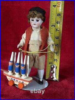 Antique German All Bisque Mignonette Boy 3 3/4 Doll Cabinet Size With Toy