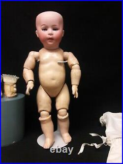 Antique German Bisque Doll by Swaine and Co. Marked D. I. P. On Toddler Body