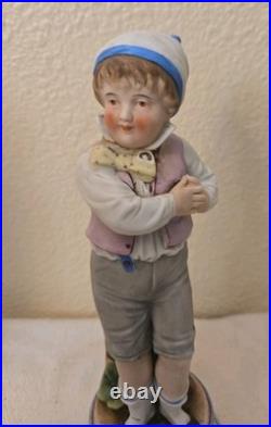 Antique German Bisque Porcelain Figures, 19th century boy and girl, Mold# 39