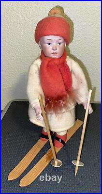 Antique German Heubach bisque doll skis Christmas candy container