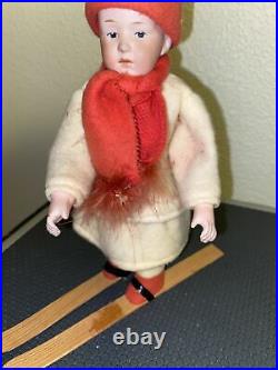 Antique German Heubach bisque doll skis Christmas candy container