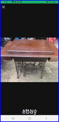 Antique German Made Sewing Machine And Cabinet