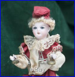 Antique German Pull Toy Bisque Clown Doll with a Wheeled Bear