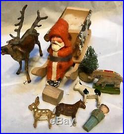 Antique Vintage Composition Santa in Sled W Toys Lead Metal Bugling Deer German