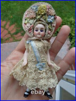 Antique dollhouse doll mignonette closed mouth & flower hat dated about 1900