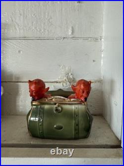 Antique early 1900s German fairing Red Devils in Purse figure, porcelain, RARE