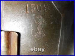 Antique vintage German metal chocolate mold with clamps sitting bear on tree trunk