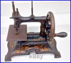 Antique vintage cast iron German  miniature child's sewing machine