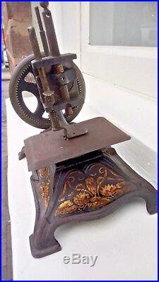 Antique vintage cast iron German  miniature child's sewing machine