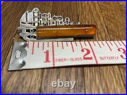 German antique pin of a fishing village amber stone stamped DRGM 835 and with a