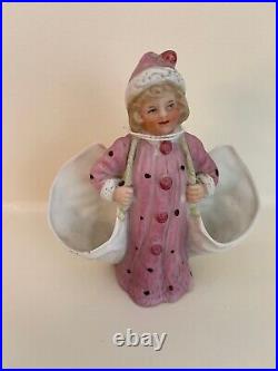 Heubach Rare Little girl in winter/pink coat carrying side pockets. Vintage
