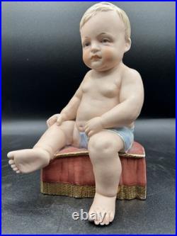 Vintage Hertwig German Porcelain Bisque-A Boy Sitting On A Fancy Pillow 8 1/2