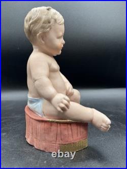 Vintage Hertwig German Porcelain Bisque-A Boy Sitting On A Fancy Pillow 8 1/2